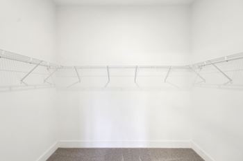 Empty room with a carpeted floor and white walls.